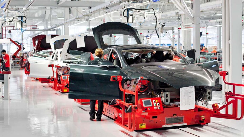 An EV production line with vehicles being assembled